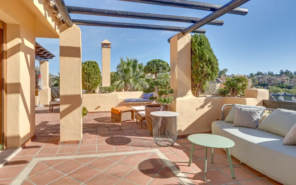 Mediterranean-style duplex penthouse with multiple terraces and a rooftop terrace with a private sauna and barbecue area